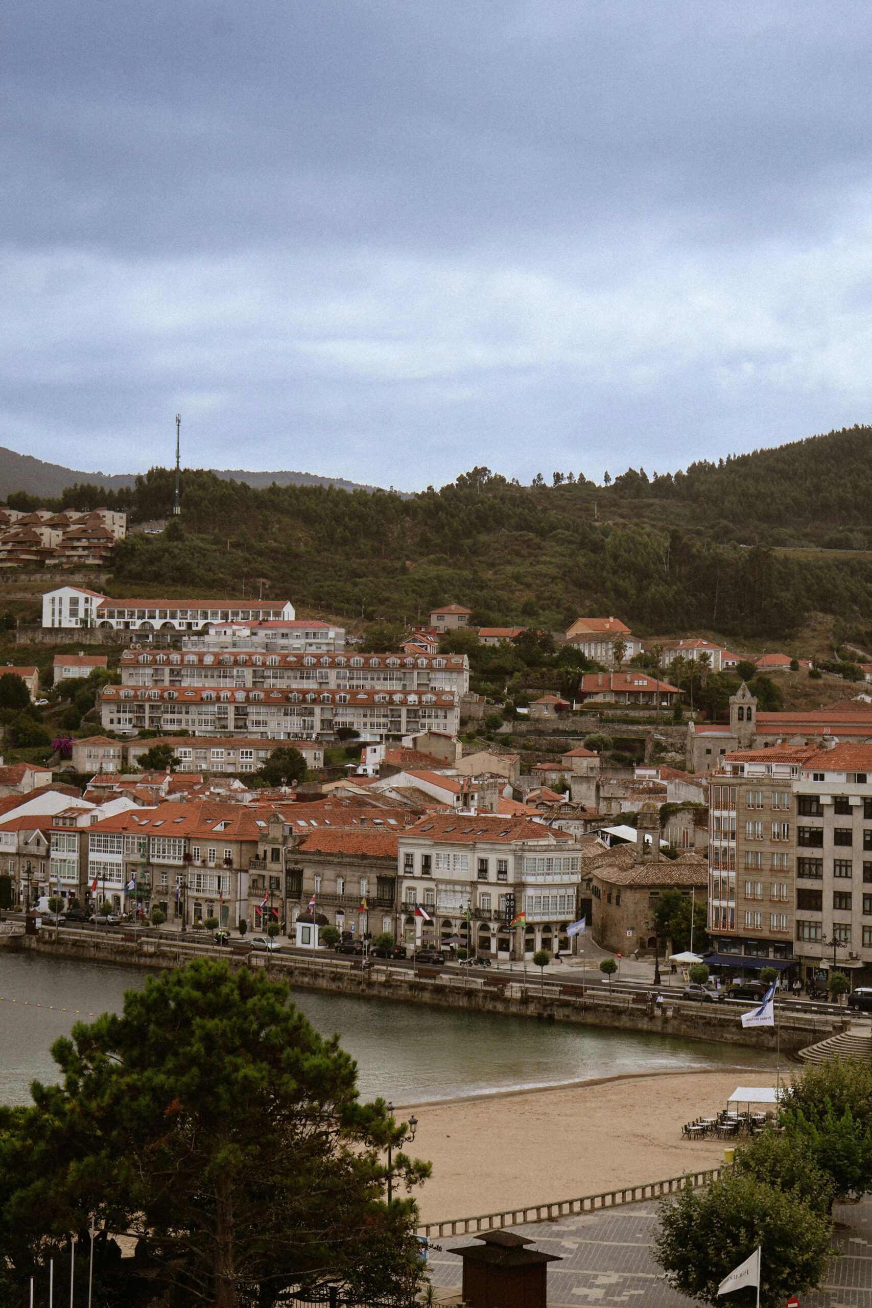 Picturesque coastal landscape of Baiona in northern Spain with historic architecture.